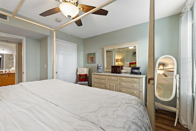 bedroom with ceiling fan and dark hardwood / wood-style floors