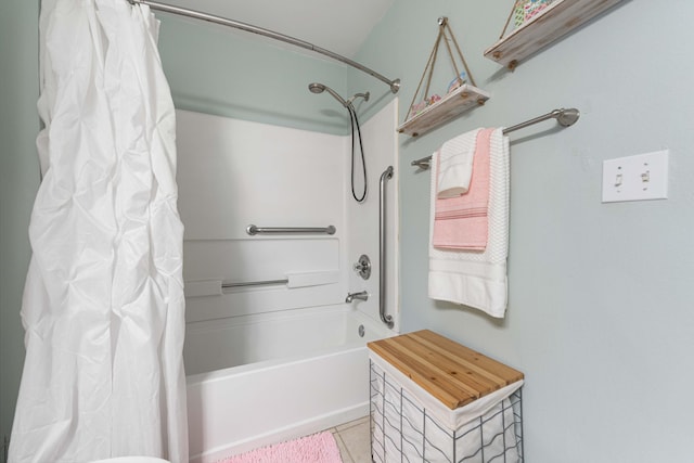 bathroom featuring tile patterned floors and shower / bath combo with shower curtain