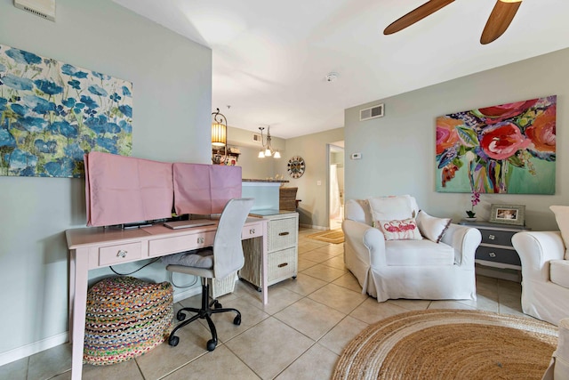 tiled home office featuring ceiling fan