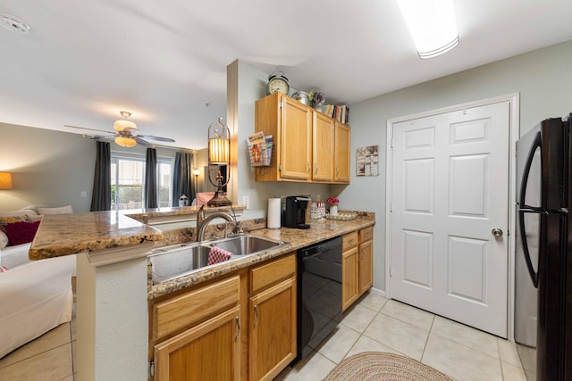 kitchen with sink, light tile patterned floors, ceiling fan, black appliances, and kitchen peninsula