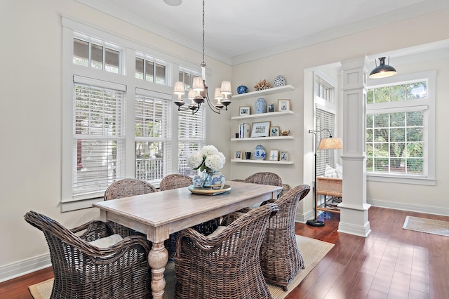 1247 Prospect Promenade, Panama City Beach, FL 32413 - dining area featuring a chandelier, dark hardwood / wood-style flooring, decorative columns, and ornamental molding