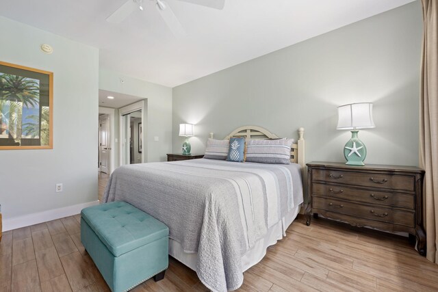 bedroom with light wood-type flooring and ceiling fan