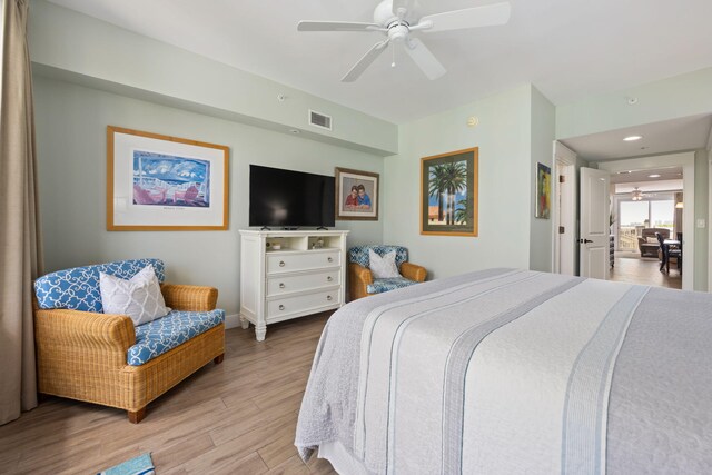 bedroom featuring light hardwood / wood-style floors and ceiling fan