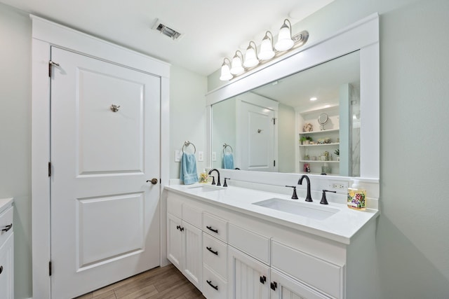 bathroom featuring vanity and hardwood / wood-style flooring