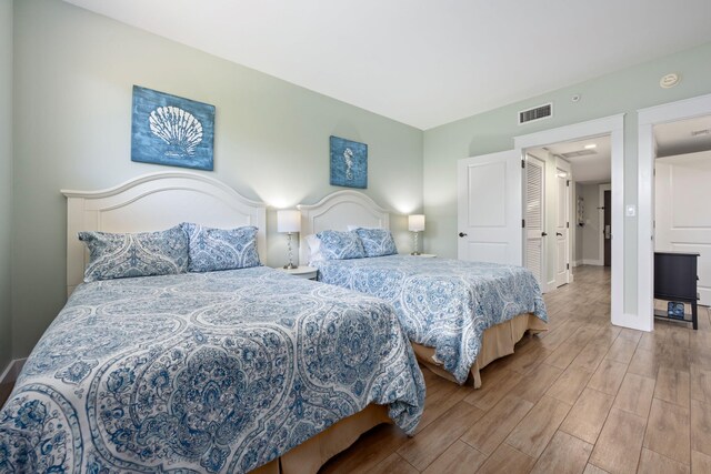 bedroom with light wood-type flooring