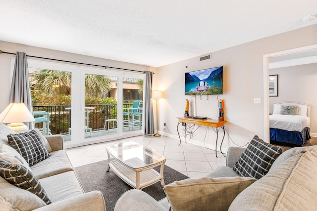 tiled living room with a textured ceiling