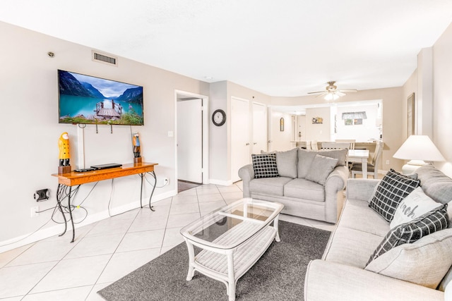 living room with ceiling fan and light tile patterned floors