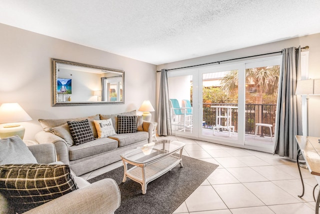 living room with light tile patterned floors and a textured ceiling