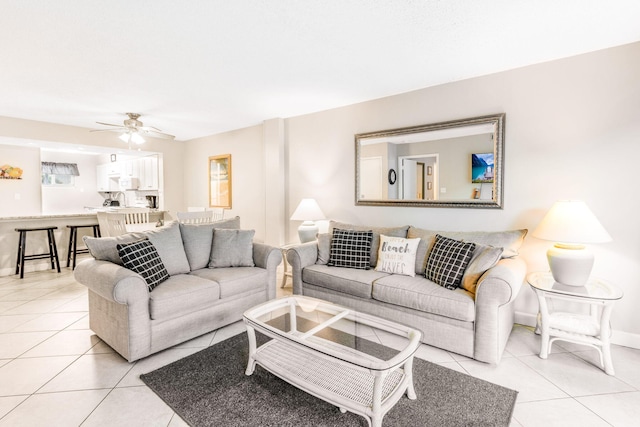 tiled living room with ceiling fan