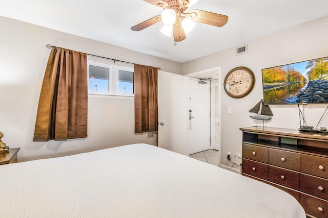 bedroom with light tile patterned flooring and ceiling fan