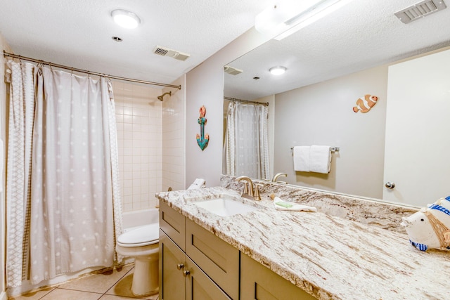 full bathroom with shower / tub combo with curtain, tile patterned floors, toilet, a textured ceiling, and vanity