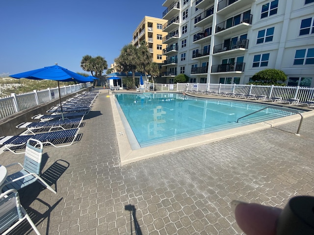 view of swimming pool featuring a patio area