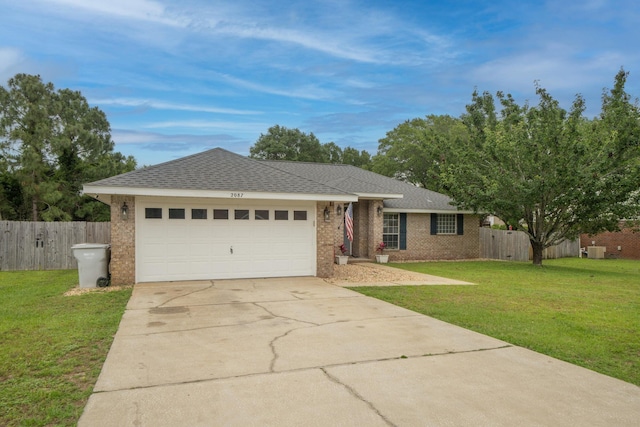 ranch-style home with a front yard and a garage