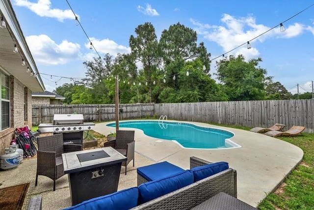 view of swimming pool with a patio, area for grilling, and outdoor lounge area