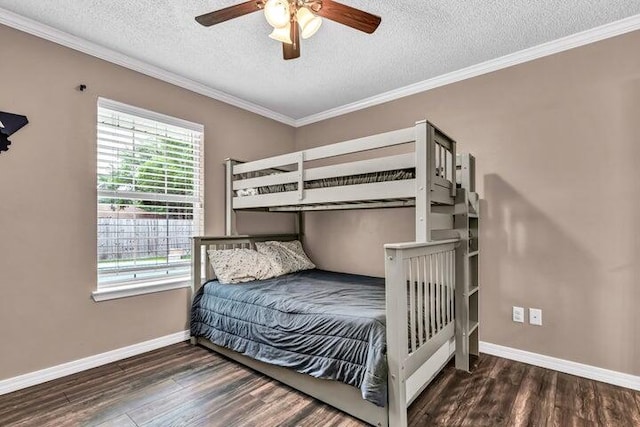 bedroom featuring a textured ceiling, crown molding, dark hardwood / wood-style floors, and ceiling fan