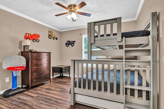 bedroom with a textured ceiling, crown molding, dark hardwood / wood-style flooring, and ceiling fan