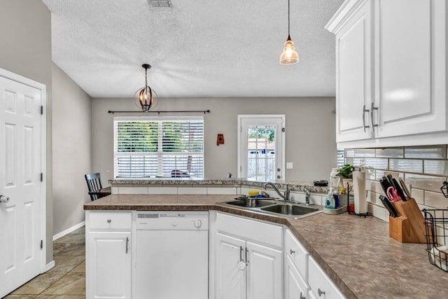 kitchen featuring white cabinets, white dishwasher, and sink