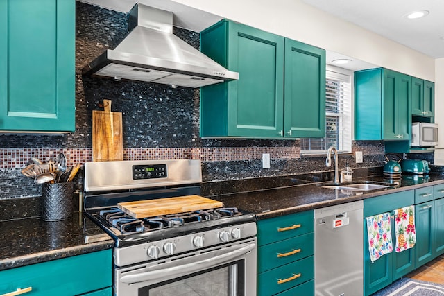 kitchen with sink, dishwashing machine, stainless steel range with gas stovetop, decorative backsplash, and wall chimney range hood