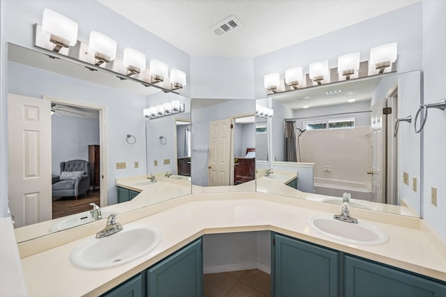 bathroom with shower / bathtub combination with curtain, tile patterned floors, a textured ceiling, ceiling fan, and dual vanity