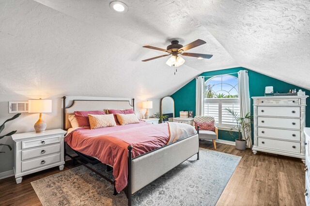 bedroom featuring ceiling fan, vaulted ceiling, a textured ceiling, and hardwood / wood-style flooring