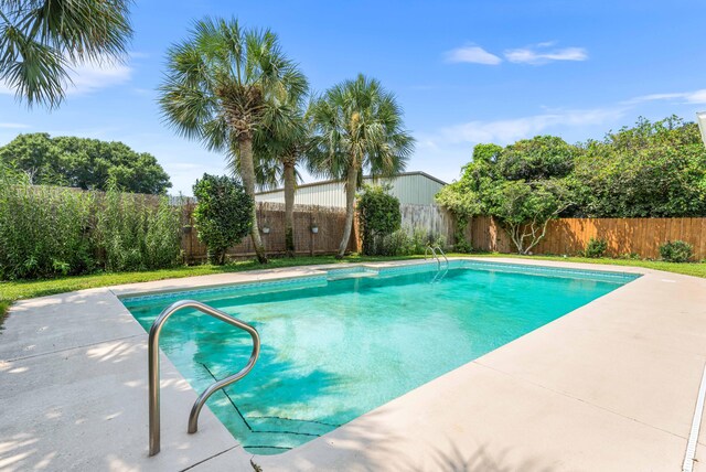 view of swimming pool featuring a patio