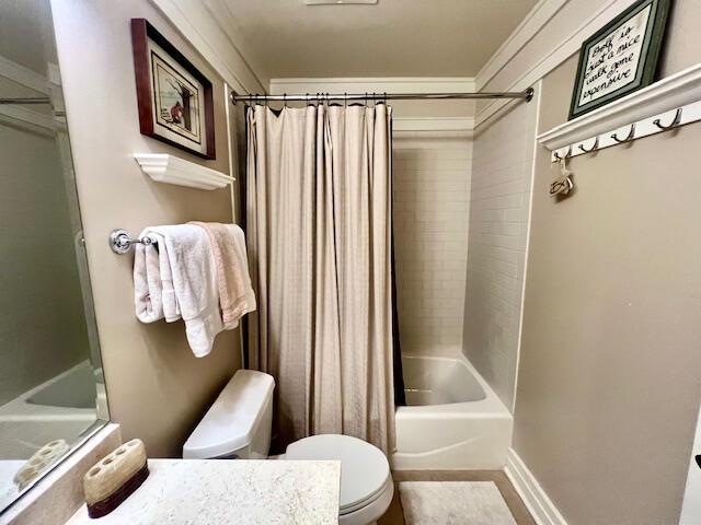 full bathroom featuring toilet, vanity, and shower / tub combo