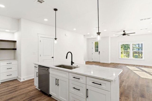 kitchen featuring dishwasher, light stone counters, hanging light fixtures, white cabinetry, and a sink