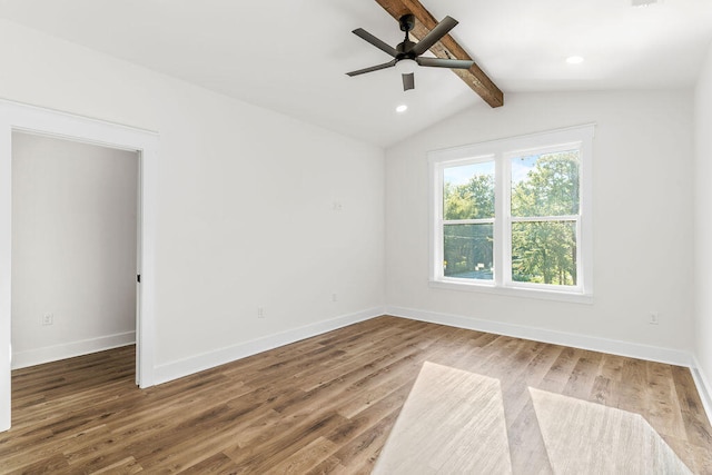 spare room featuring recessed lighting, lofted ceiling with beams, a ceiling fan, wood finished floors, and baseboards