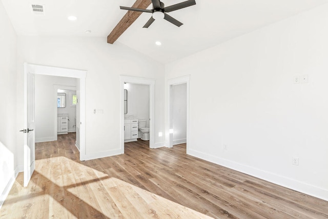 unfurnished bedroom featuring lofted ceiling with beams, light wood-type flooring, visible vents, and baseboards