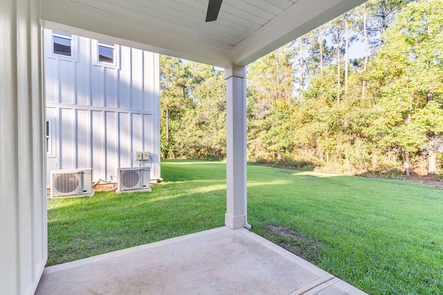 view of yard featuring a ceiling fan, ac unit, and a patio