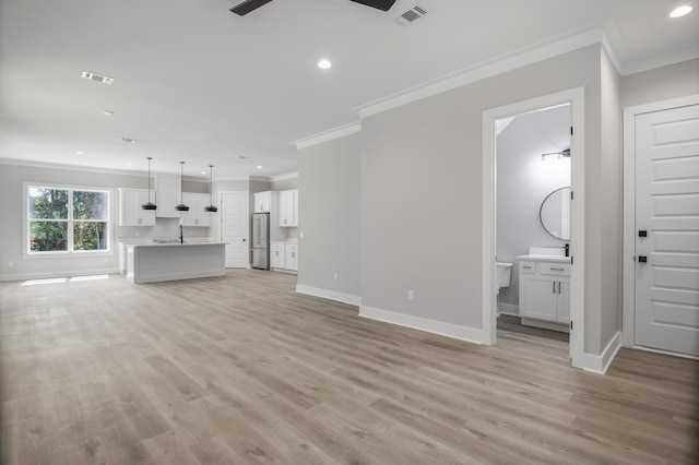 unfurnished living room with light wood-style flooring, recessed lighting, visible vents, and baseboards