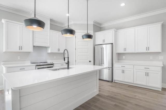 kitchen with stainless steel appliances, hanging light fixtures, light countertops, and white cabinetry