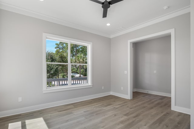 unfurnished bedroom featuring crown molding, recessed lighting, a ceiling fan, light wood-type flooring, and baseboards