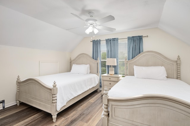 bedroom featuring ceiling fan, vaulted ceiling, and dark hardwood / wood-style flooring