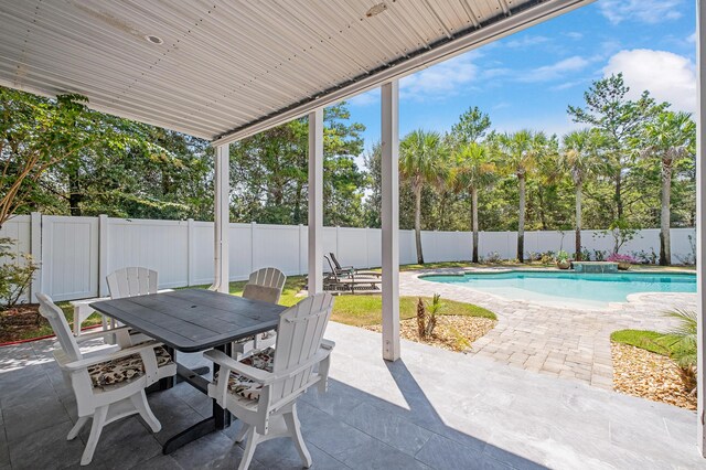 view of patio / terrace featuring a fenced in pool