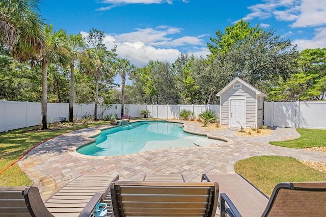 view of swimming pool featuring a shed