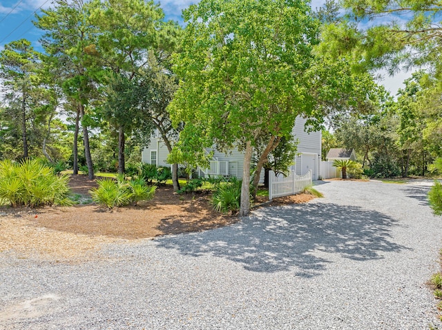 view of side of property with a garage