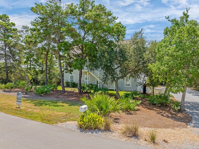 view of property hidden behind natural elements