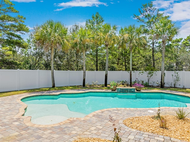 view of swimming pool featuring a patio area