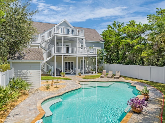 view of pool featuring a patio and ceiling fan