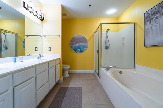 full bathroom with toilet, double sink vanity, independent shower and bath, and tile patterned floors