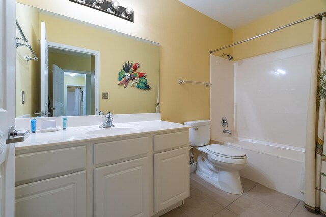 full bathroom featuring tile patterned flooring, toilet, shower / tub combo with curtain, and vanity