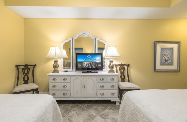 bedroom with tile patterned floors