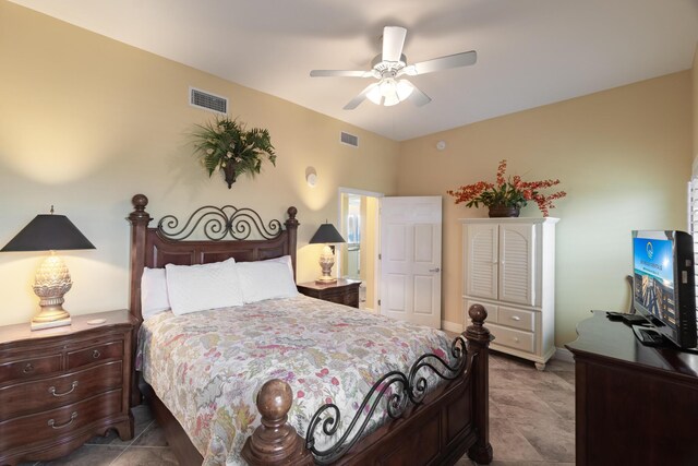 tiled bedroom featuring ceiling fan