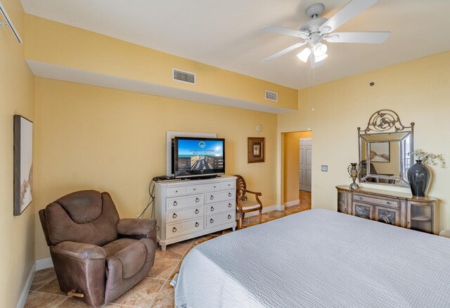 bedroom with ceiling fan and light tile patterned flooring