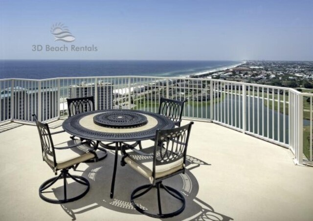 balcony featuring a water view