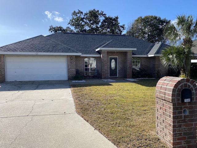 single story home with a garage and a front yard