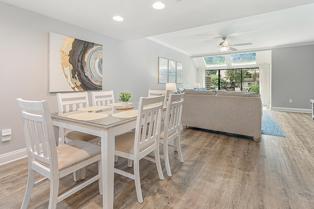 dining area featuring hardwood / wood-style floors, ceiling fan, and ornamental molding