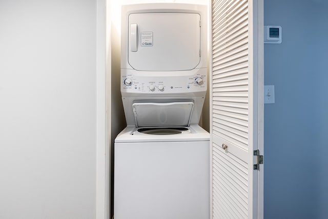 laundry room featuring stacked washer / dryer