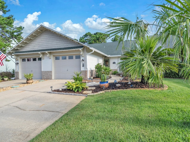 view of front facade with a front lawn and a garage